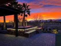 Evening-sunset-over-patio-with-enclosed-spa-made-of-brick-pavers