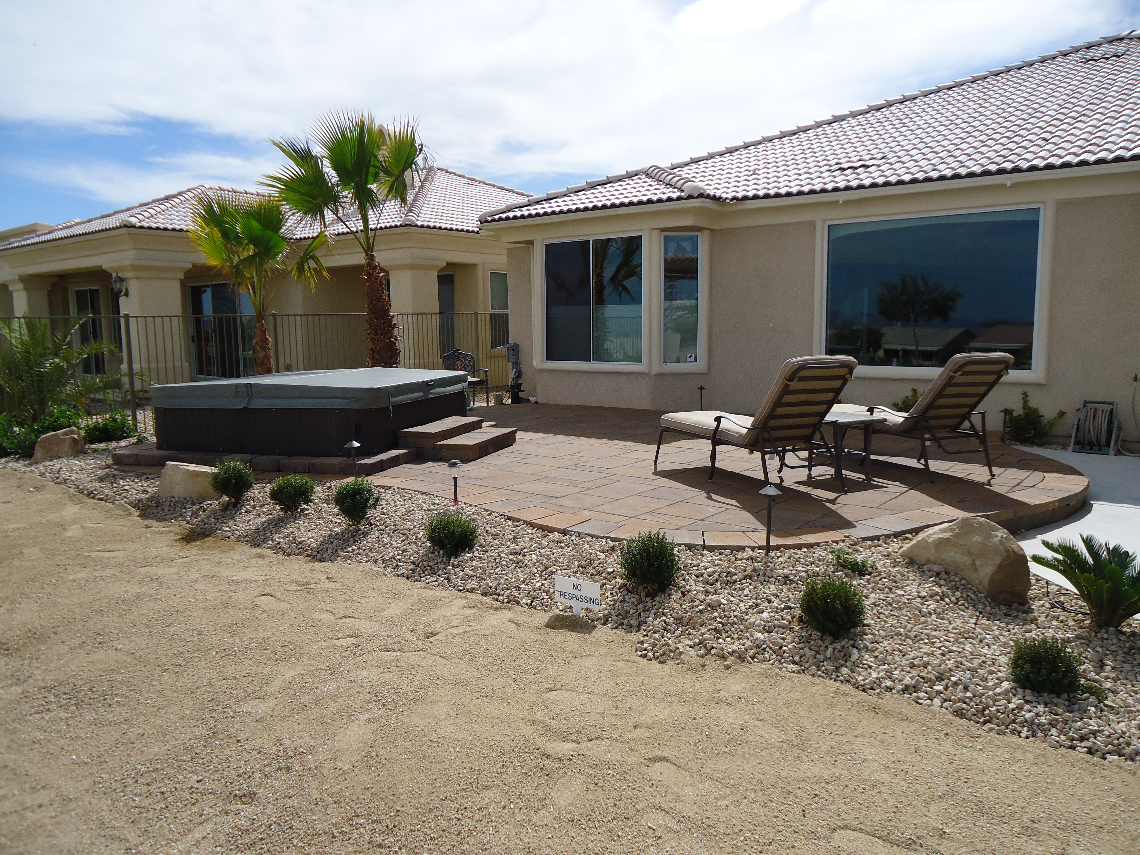 A comfortable Nevada yard, with a spa hot tub and paver patio.