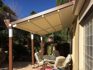 A comfortable deck with a fully extended retractable awning.
