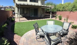 Picture of paver patios in a backyard.